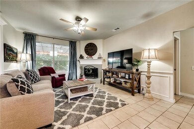 Living room with fireplace and large window allows