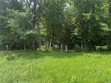View of yard with a view of trees