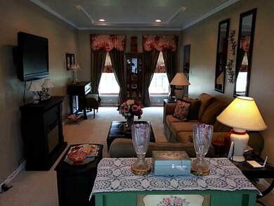 Living Room. recessed lighting, trayed ceilings wi