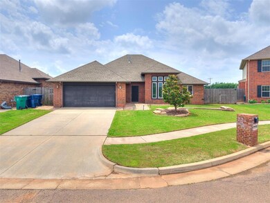 View of front facade with brick siding, a garage, a shingled roof, and concrete driveway