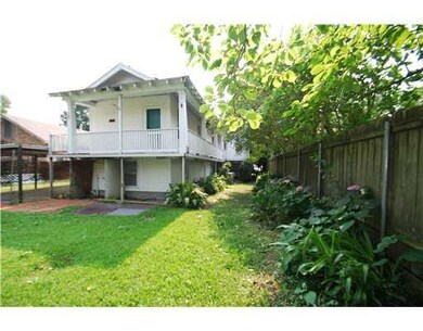 Exterior Back. Balconies and porches surround rear