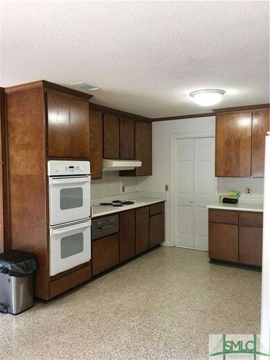 kitchen area adjacent to family room and dining ar