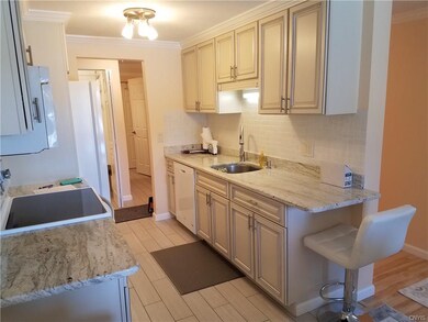 Granite counters, Whirlpool appliances, Gray plank