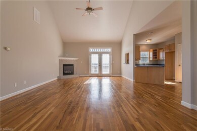 Great Room with vaulted ceilings and gas log fireplace