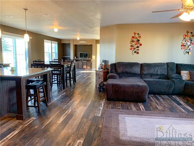 Living room, dining room, and kitchen open to one