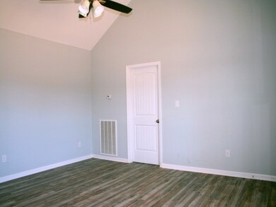 Lots of space for sectional, 2 couches, and Lazy boy! Cathedral ceiling.