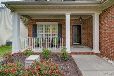 A planting bed greets you as you approach the home