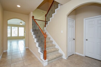 View into entry of home and staircase.