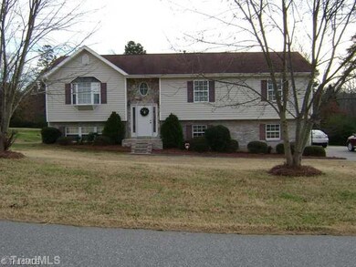 Exterior Front. Great Family Home in Quiet Neighborhood sits on 1/2 acre lot.
