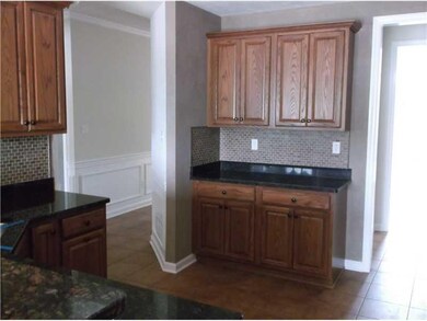 Kitchen. Kitchen cabinets and tile floor