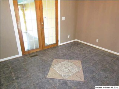 Custom decorative tile in the eat-in kitchen