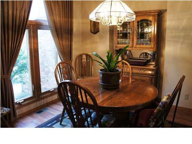 Formal dining with new wood laminate flooring.