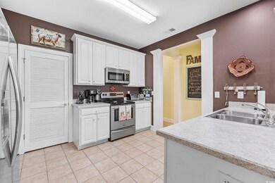 Kitchen featuring light countertops, visible vents