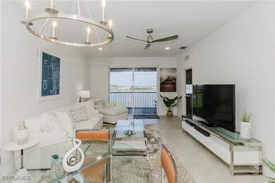 Living area featuring ceiling fan, light tile patt