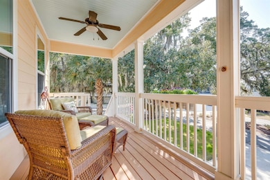 Wooden deck with a porch and ceiling fan