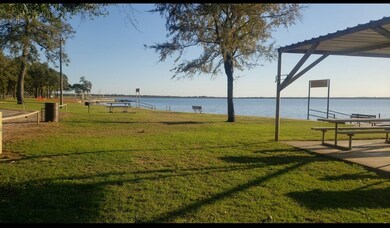 View of home's community with a water view and a l