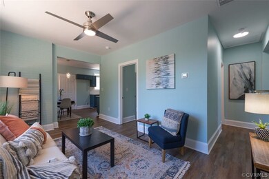 Living room with dark hardwood / wood-style floori