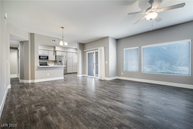 Unfurnished living room with dark wood-style floor