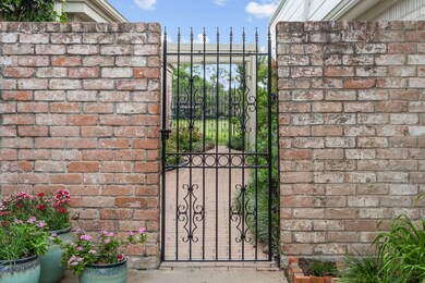 Tucked just beyond a secure wrought-iron gate, thi