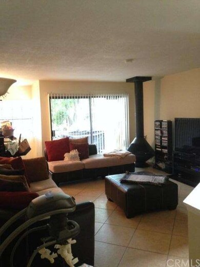 living room with sliding glass door to patio. 