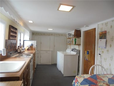 Kitchen has tons of original built in cabinets for