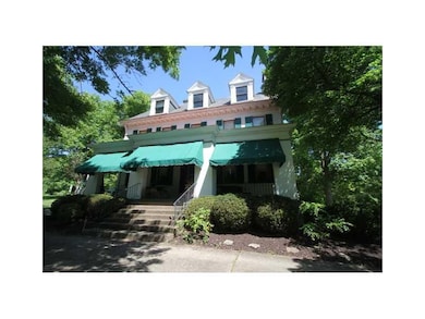 Exterior Front. A 39x9 covered porch welcomes gues