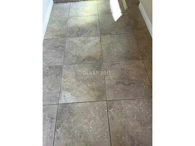 Entry Hall. Large tile in entry way leading to fam