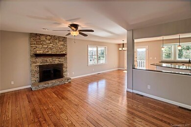 Great room open to the kitchen and dining room wit