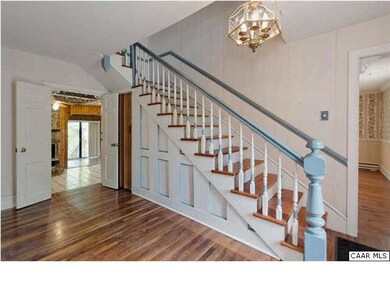 Stairway in the foyer.  Notice the beautiful walnu