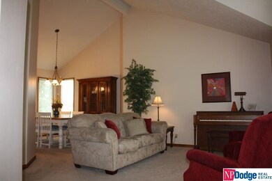 Cathedral ceilings really opens up this well lit room.