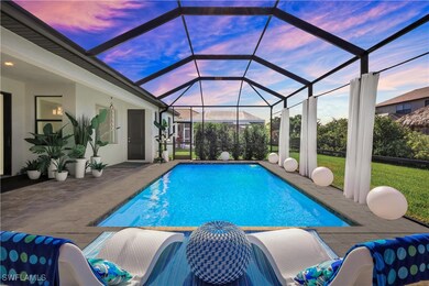 Pool at dusk with a lawn, glass enclosure, and a p