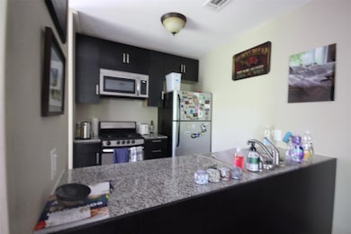 Kitchen featuring appliances with stainless steel