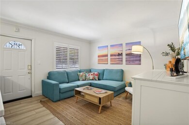 Living room featuring ornamental molding and light