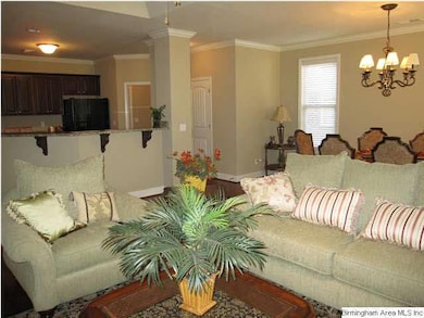 Living room open to dining room and kitchen.