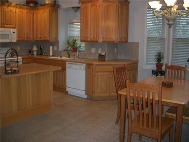 Eat-in-kitchen with tile floor.