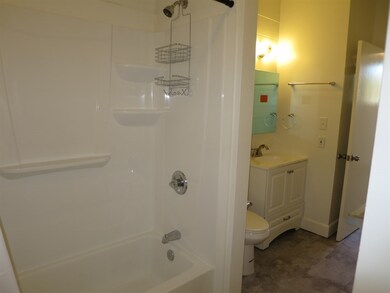 Main bath is a full bath with a tub next to a door