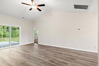 Unfurnished room with lofted ceiling, hardwood / w
