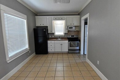 Garage apartment kitchen has full size refrigerato