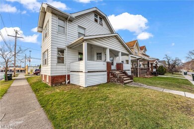 View of front facade with a front lawn and a porch