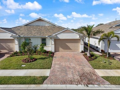 Ranch-style home featuring a front lawn and a gara