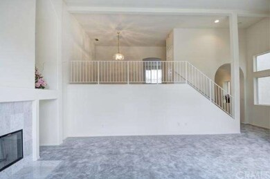 Living room leads up to mid level where formal din