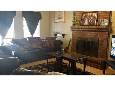 Living Room with window and fireplace vi