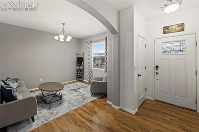 Foyer entrance featuring a notable chandelier and 