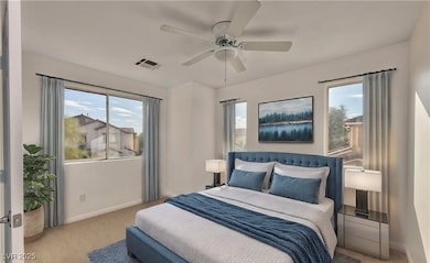 Carpeted bedroom featuring ceiling fan, baseboards
