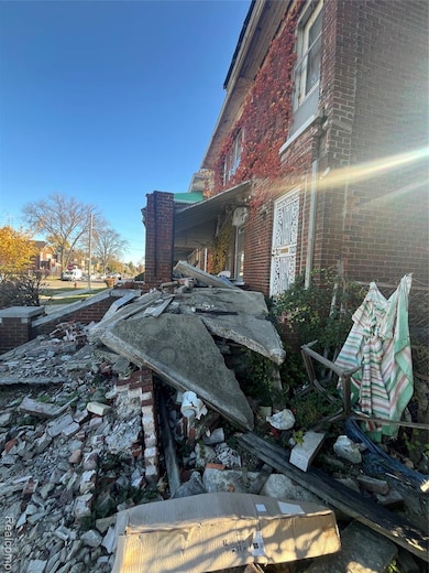 View of side of property featuring brick siding