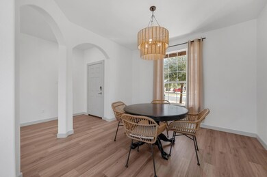 Dining area with light wood-style flooring, baseb