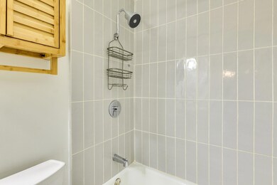 Bathroom featuring shower / bathing tub combinati