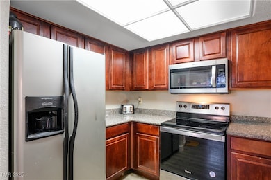 Kitchen featuring appliances with stainless steel finishes