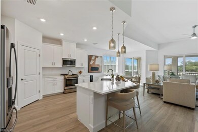 Kitchen featuring white cabinets, appliances with 