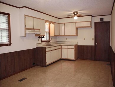 Kitchen newly painted, cabinets replaced 5 yrs ago. Door leads to full basement.